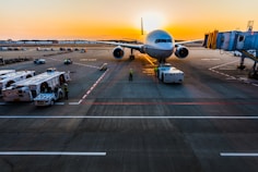 gray airplane on parking