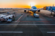 gray airplane on parking