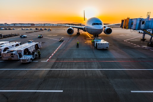 gray airplane on parking