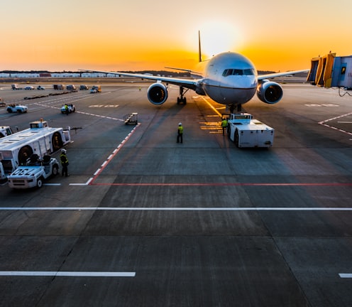 gray airplane on parking