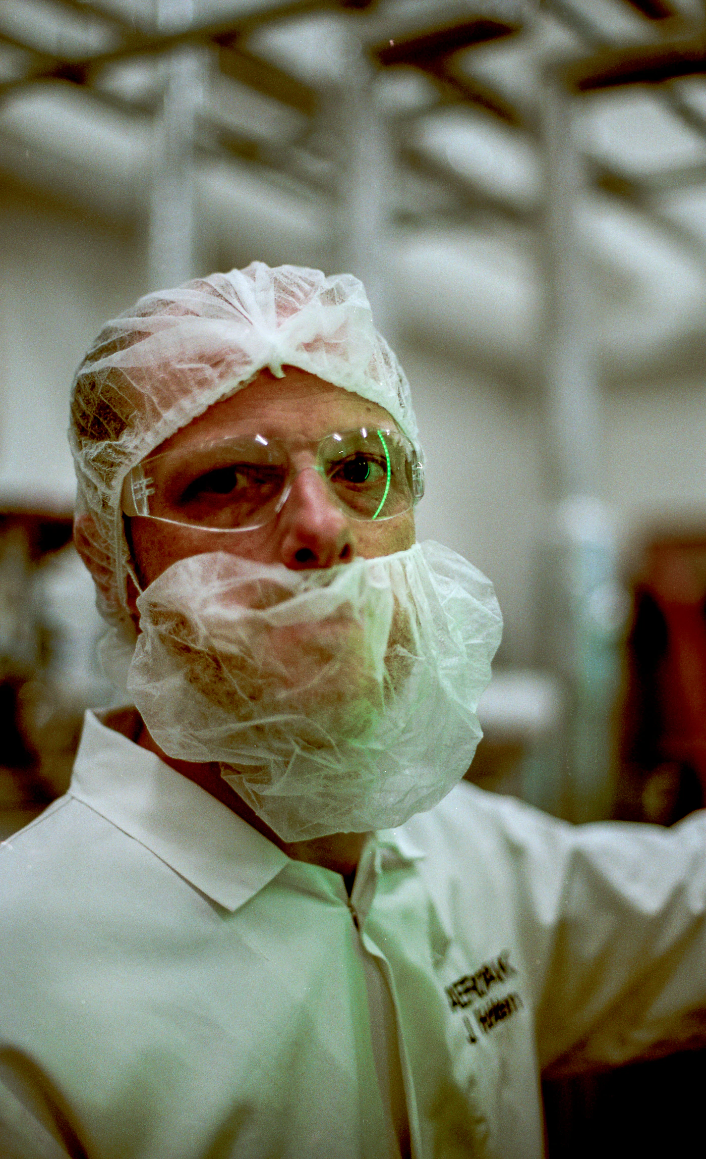 Engineer in protective gear inside an industrial facility