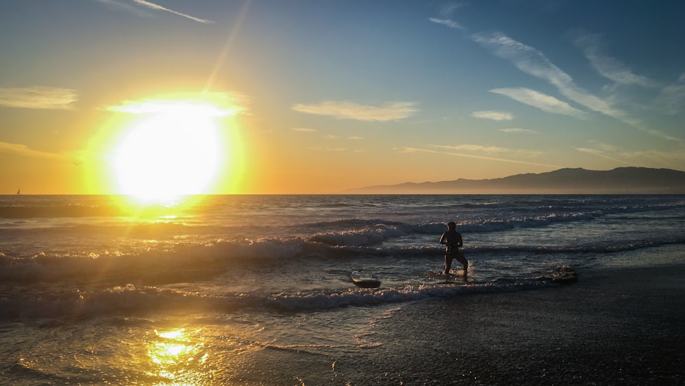 person standing on seashore