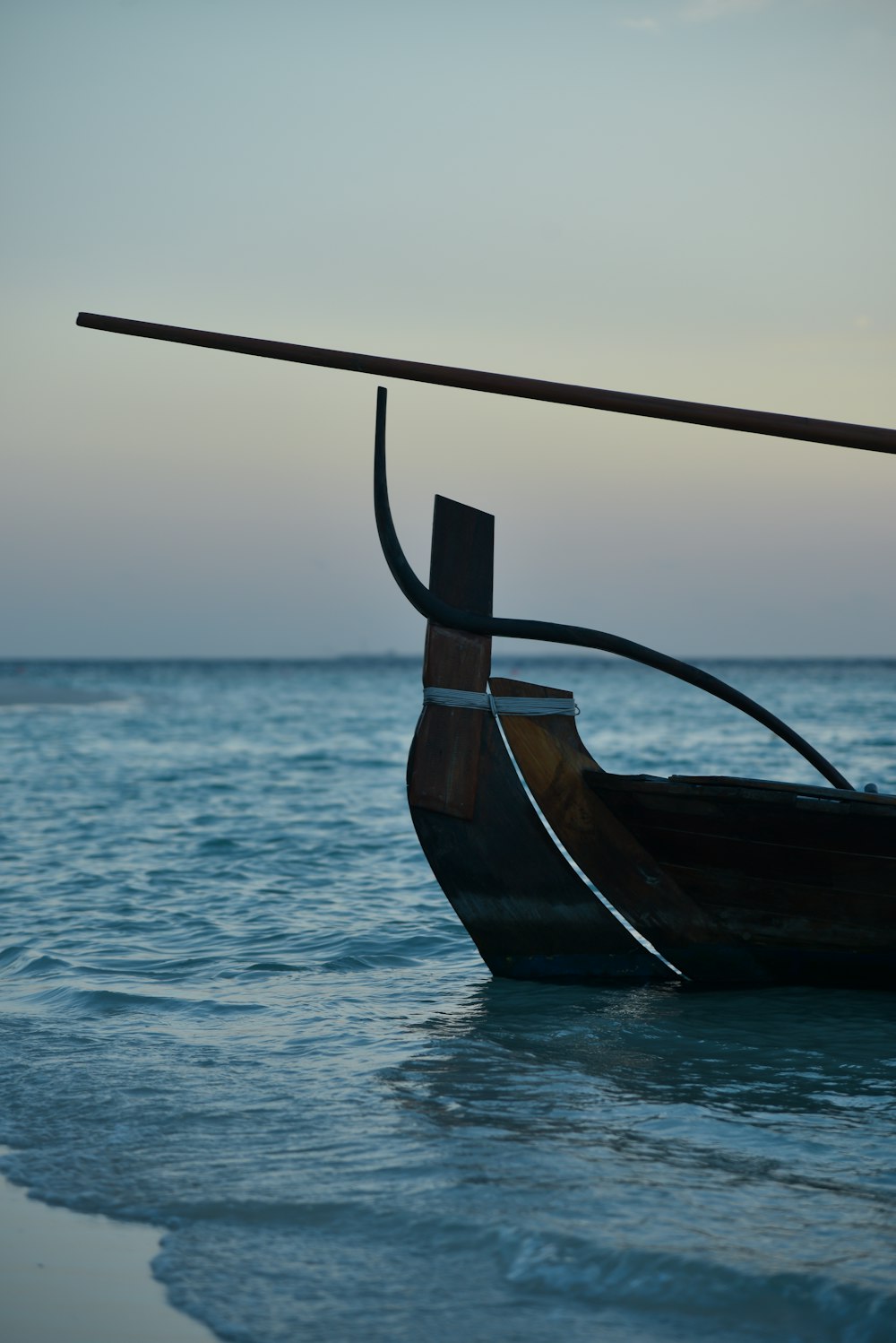 brown and gray canoe boat