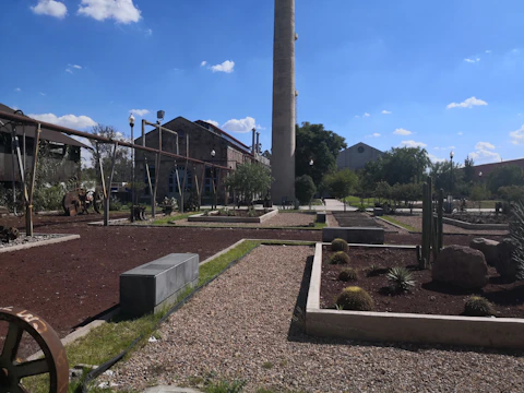 A clean, modern facility for soil remediation surrounded by desert plants.