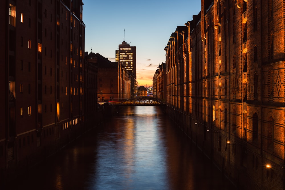 a river running through a city next to tall buildings