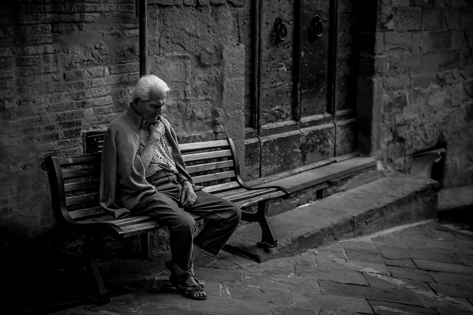 Sigma 50mm F1.4 DG HSM Art sample photo. Man sitting on brown photography