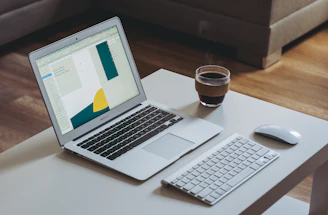A sleek, modern workspace with a laptop, notebook, and a cup of coffee, symbolizing open communication.