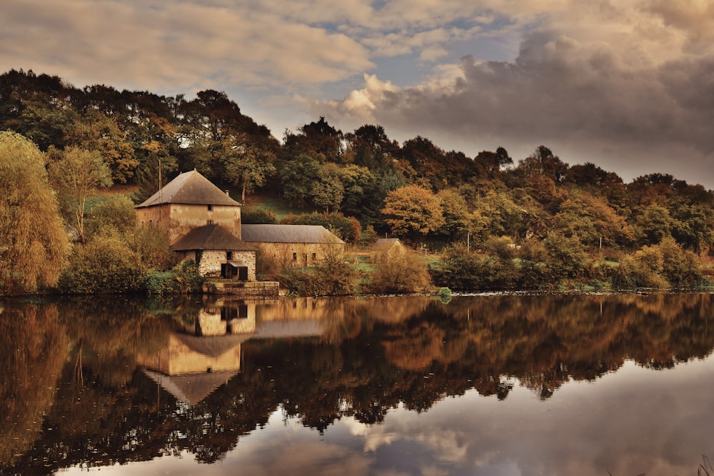 concrete house beside lake