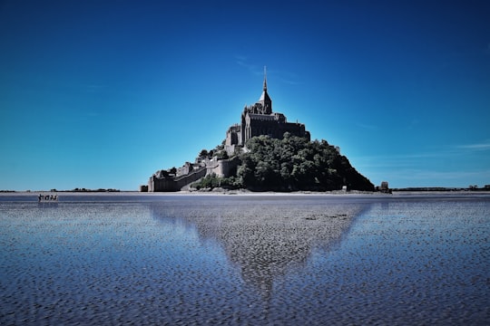building structure near body of water in Mont Saint-Michel France