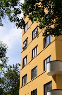 beige concrete building near trees during daytime