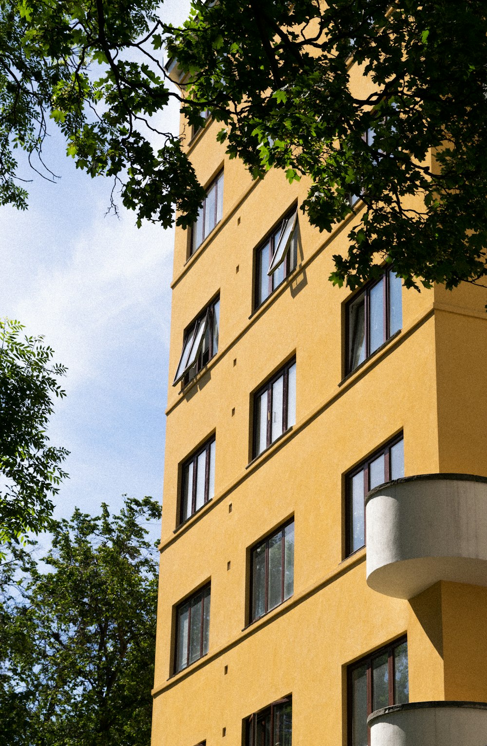 beige concrete building near trees during daytime