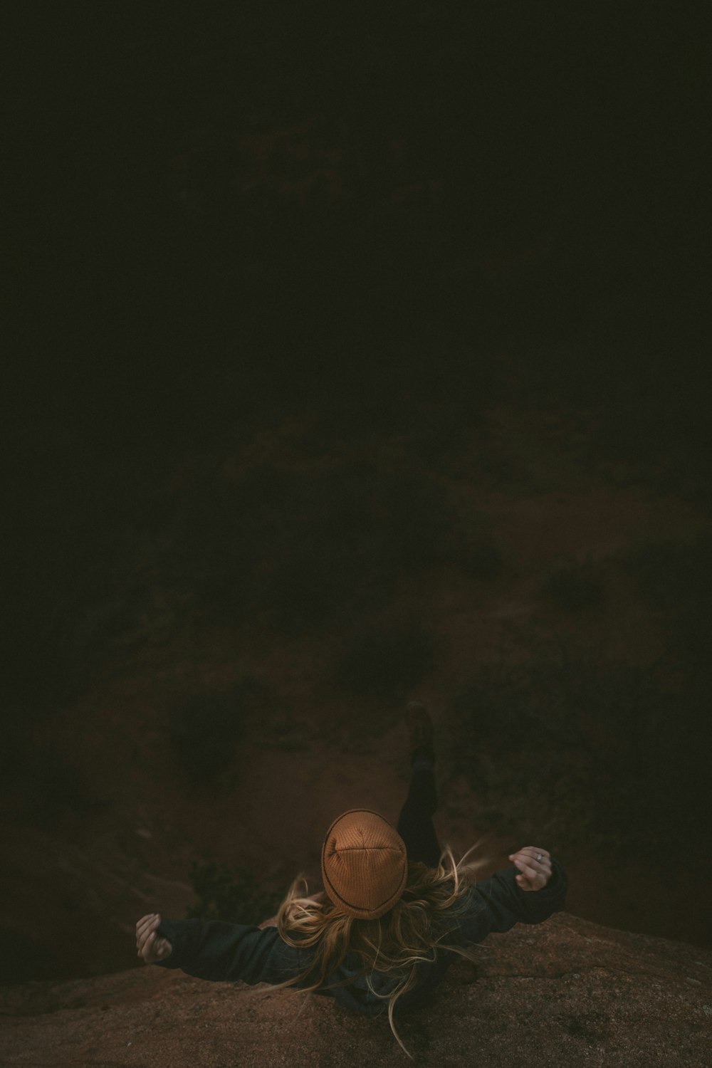 woman standing near cliff