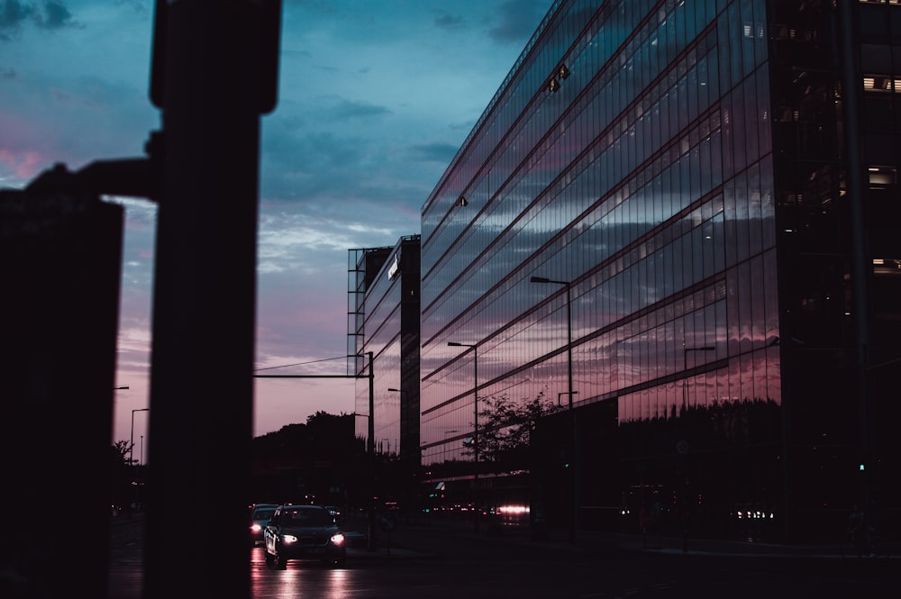 vehicles passing mirror building