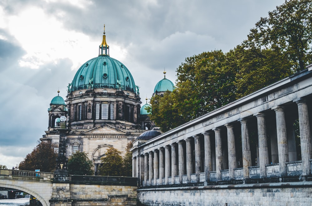 green and gray dome building under white clouds during daytime