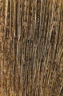 Detailed view of curtain fabric with intricate patterns and textures