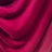 Rich, velvety fabric with deep folds and a smooth texture, creating an elegant and luxurious appearance.