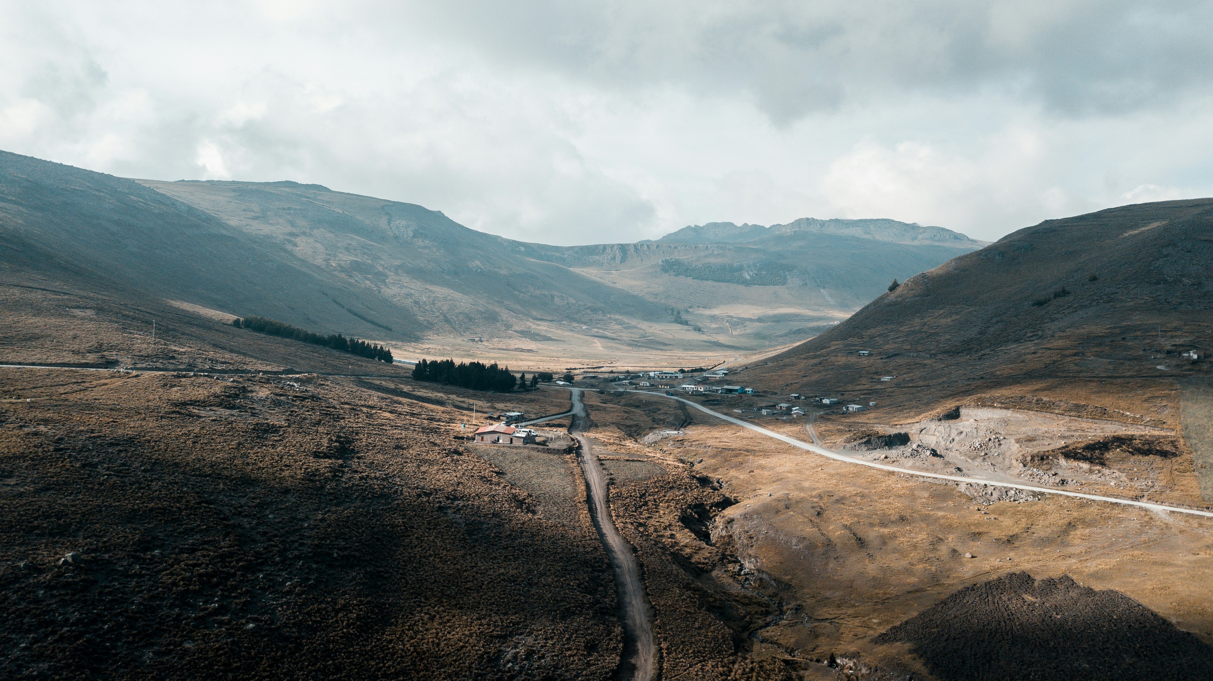 aerial photography of road between mountains during daytime