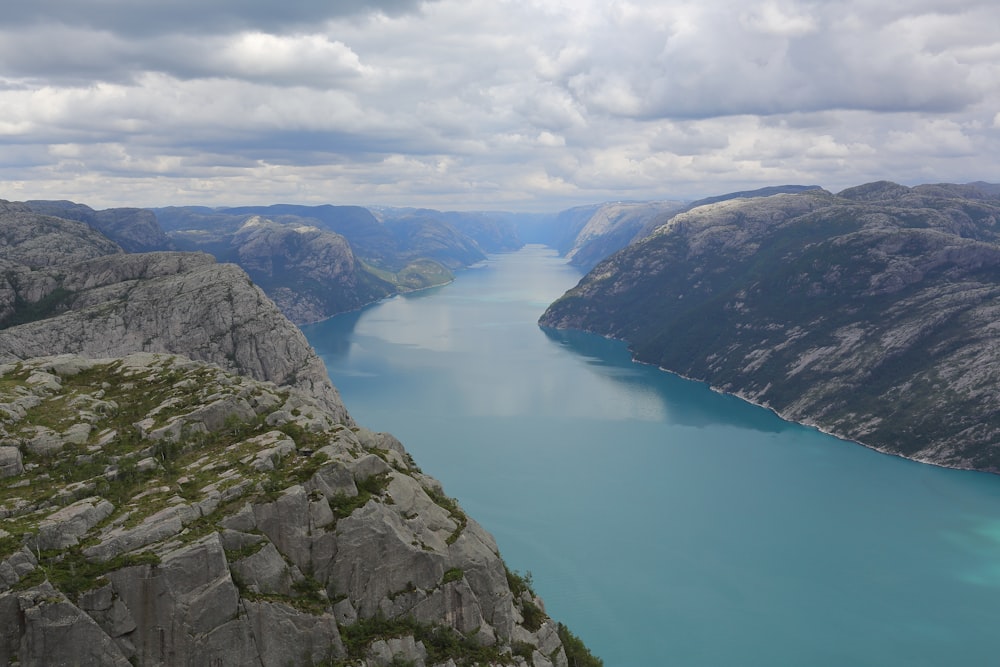 body of water under white sky