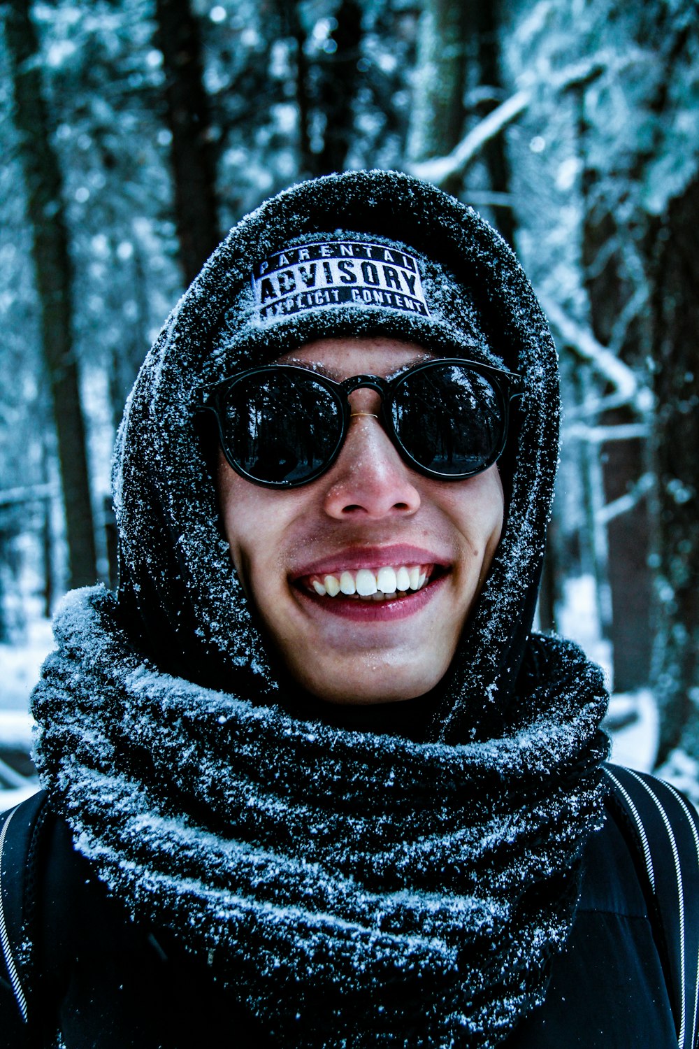 man wearing sunglasses and scarf