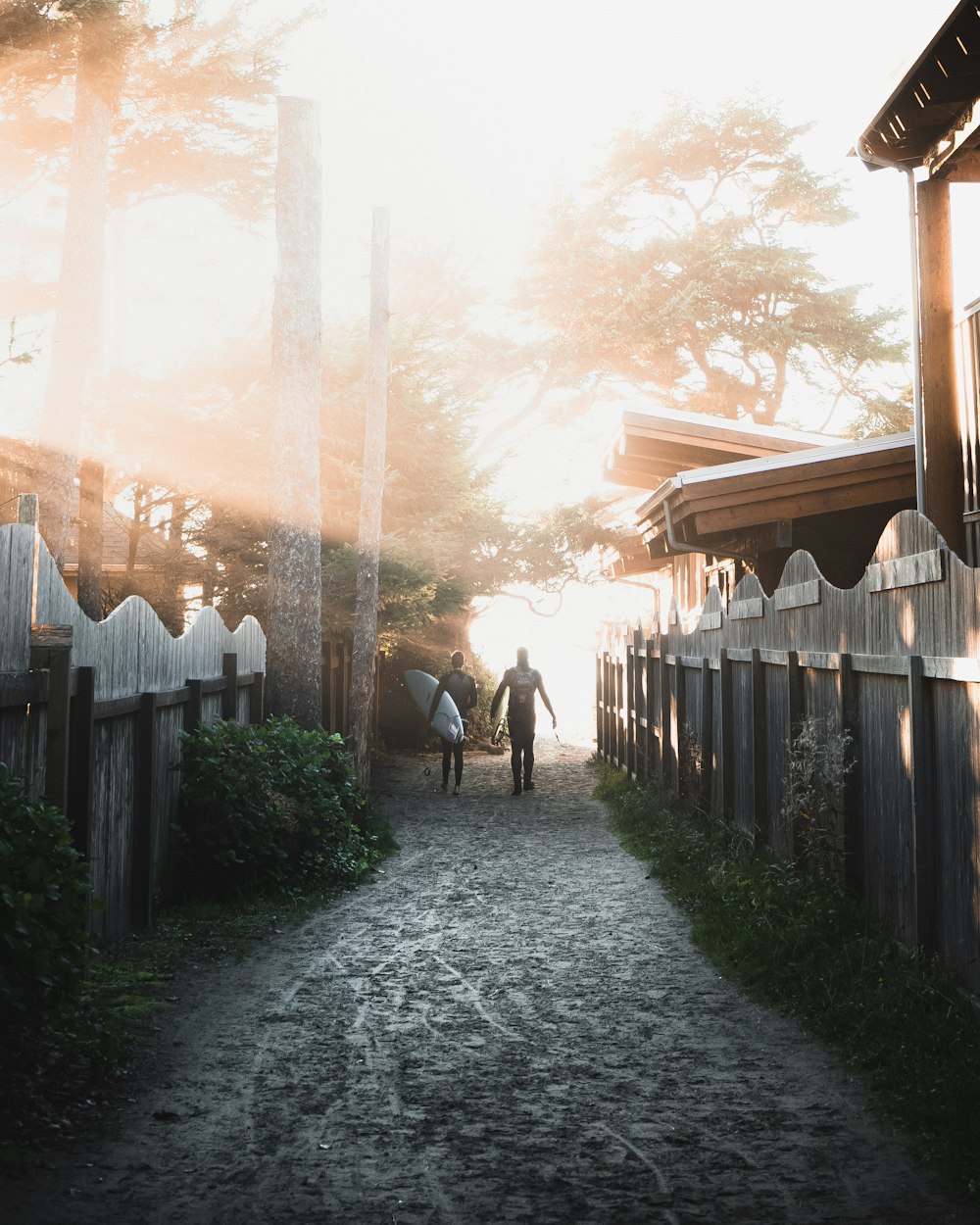 two man surrounded by houses