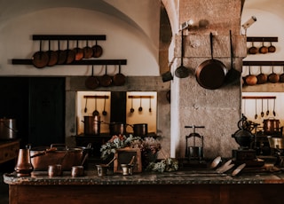 kitchen filled with cooking pans and kitchen utensils