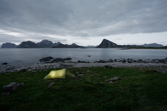 green cabin tent near sea in Napp Norway