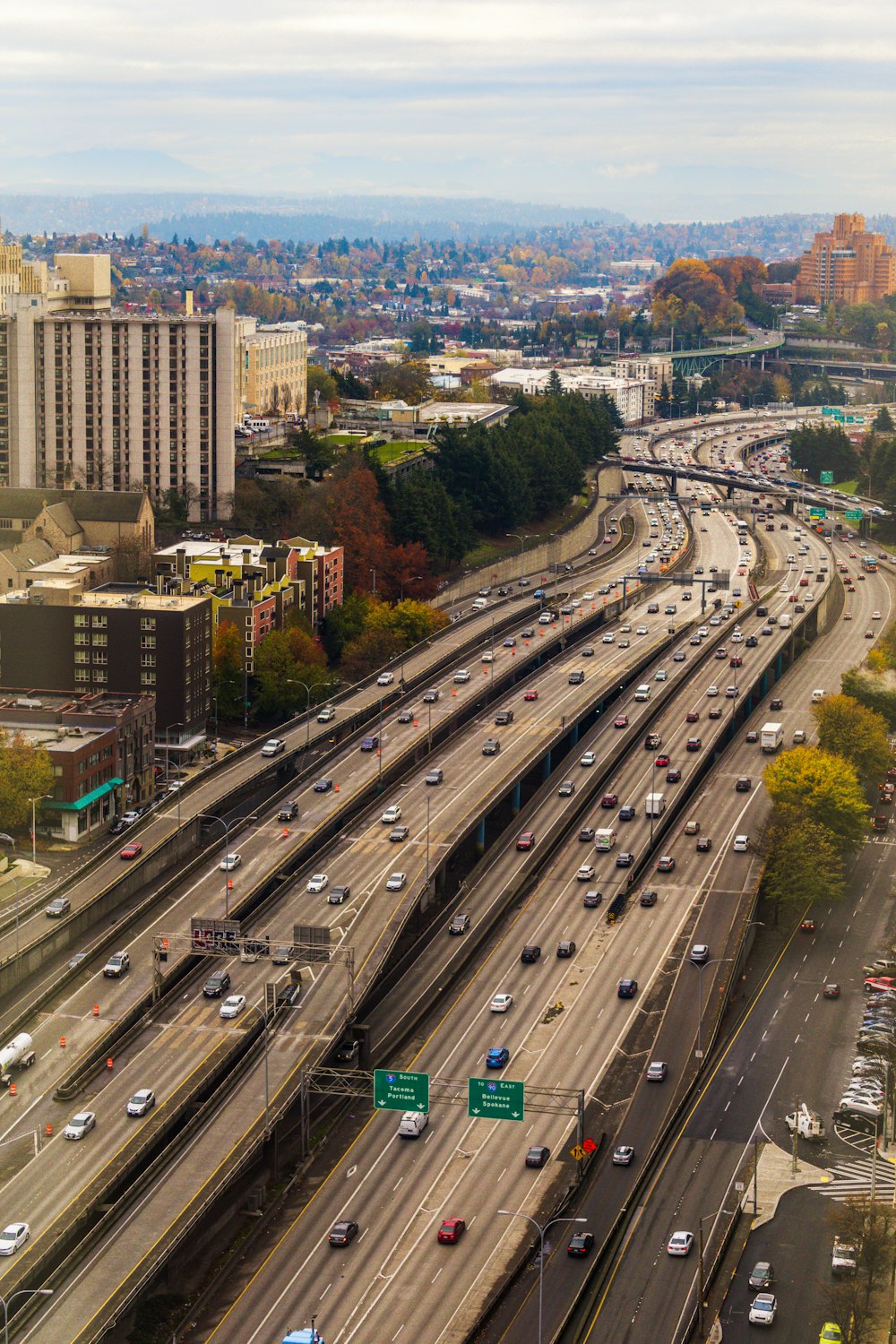 aerial photo of cars passing by concrete bridge