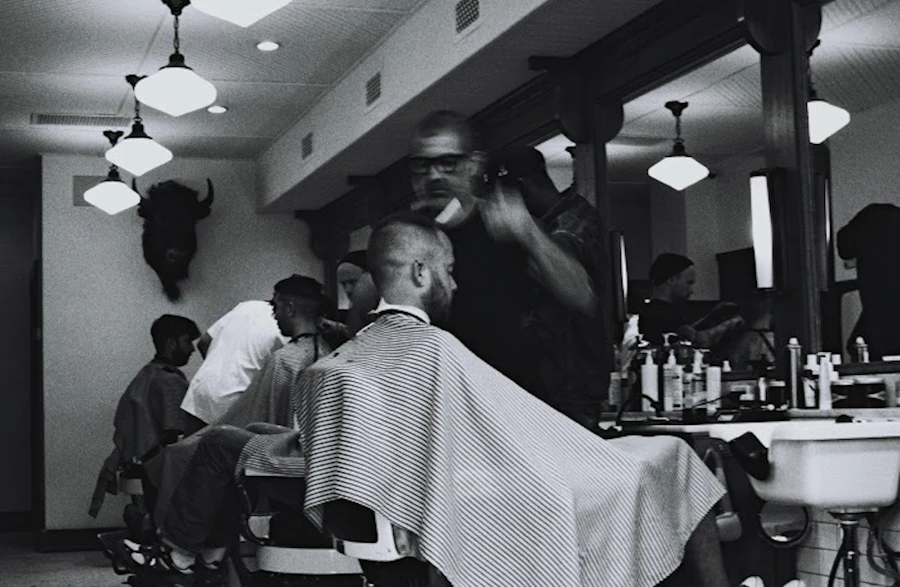 Barber giving a client a fresh cut