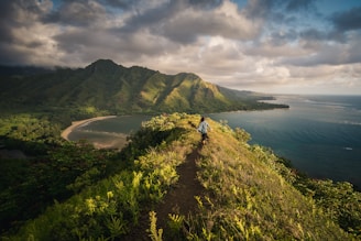woman standing on hill in islet