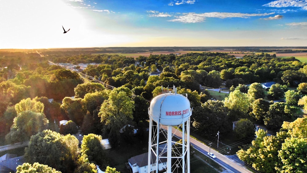 bird's-eye view photography of water tank near city