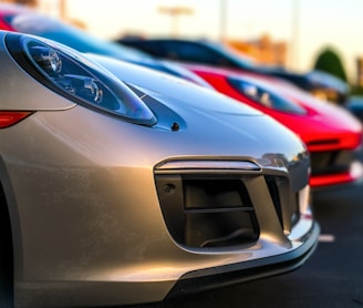 two red and gray vehicles selective focus photography