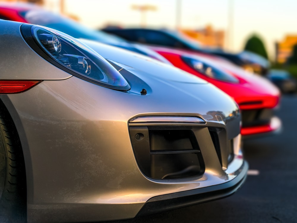 two red and gray vehicles selective focus photography