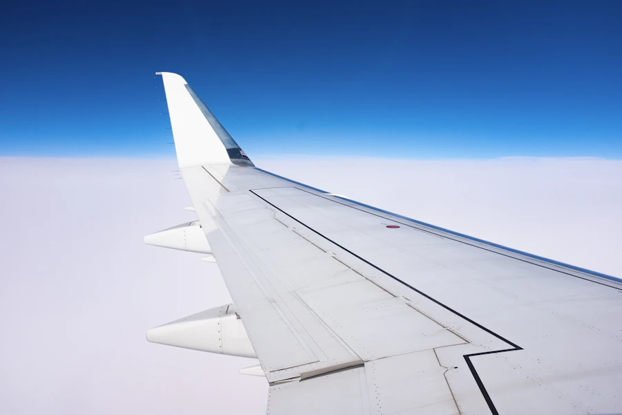 Airplane wing above the clouds