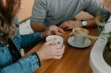 two mugs with coffee on table