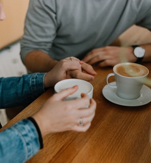 two mugs with coffee on table