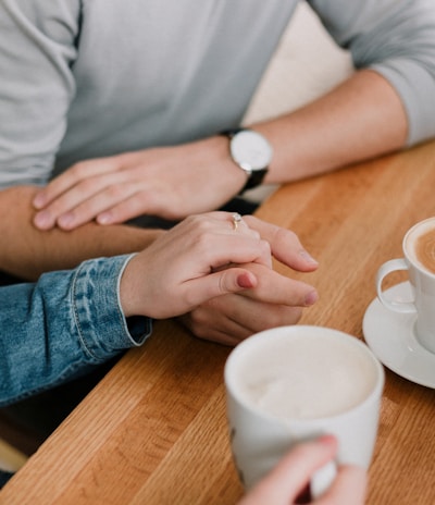 man and woman holding hands