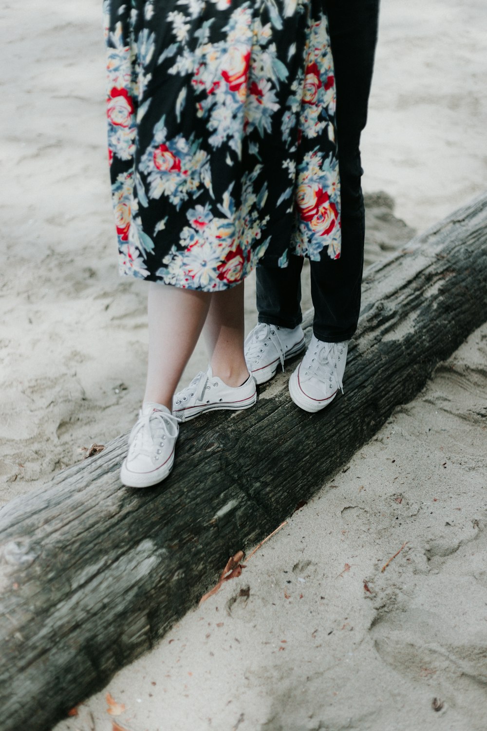 two pairs of white low-top shoes