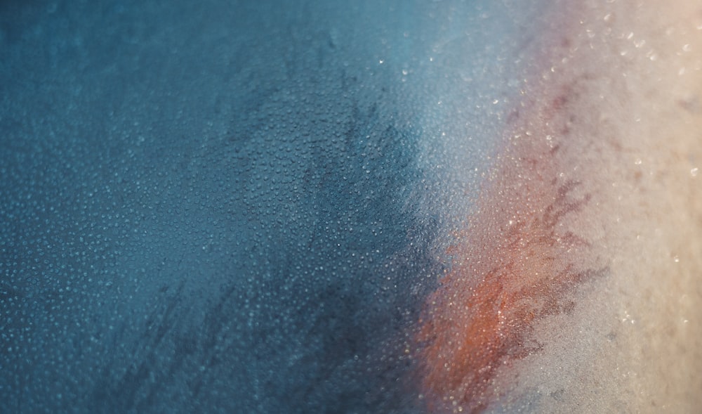 a close up of a window with water drops on it