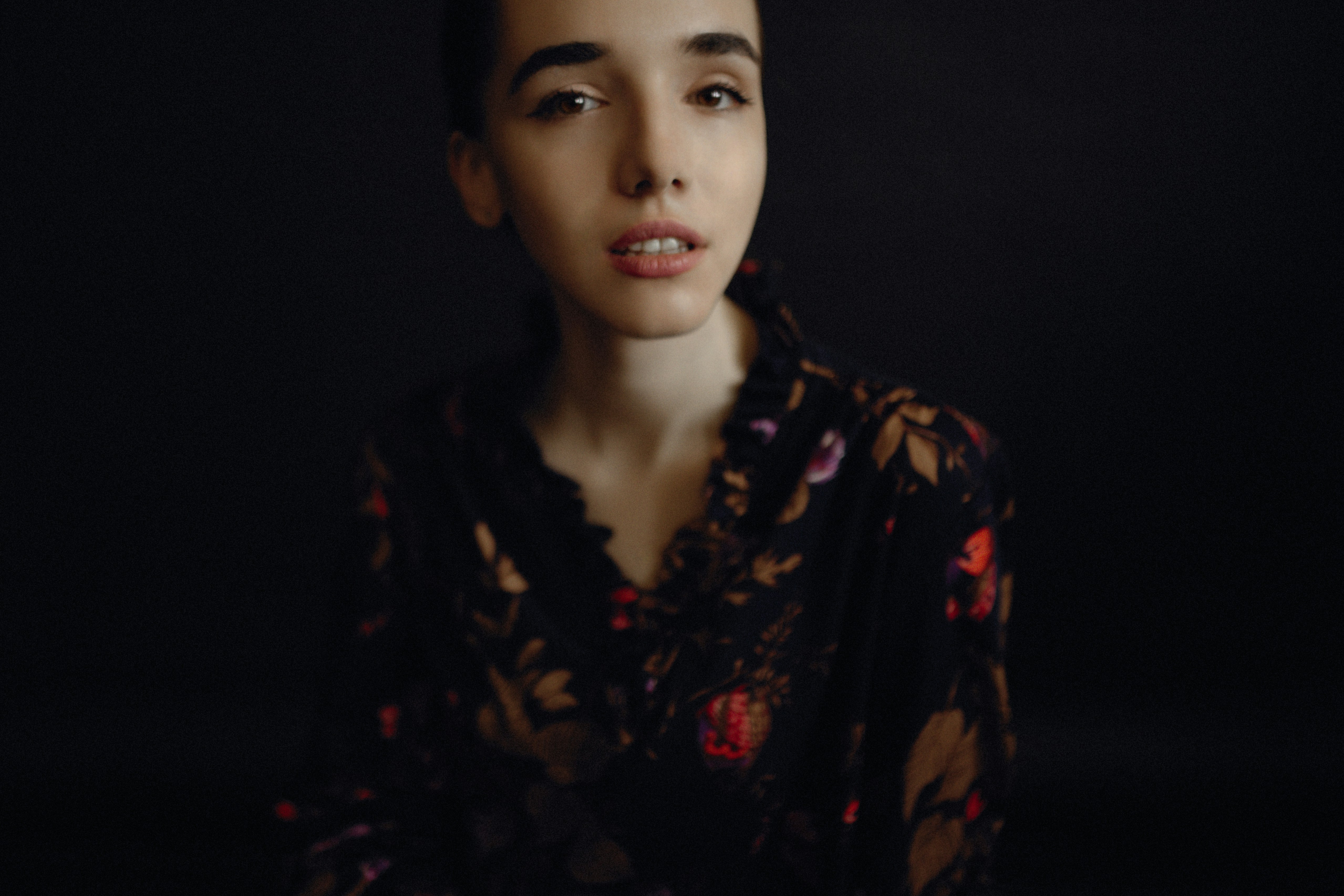 woman wearing black and red floral top
