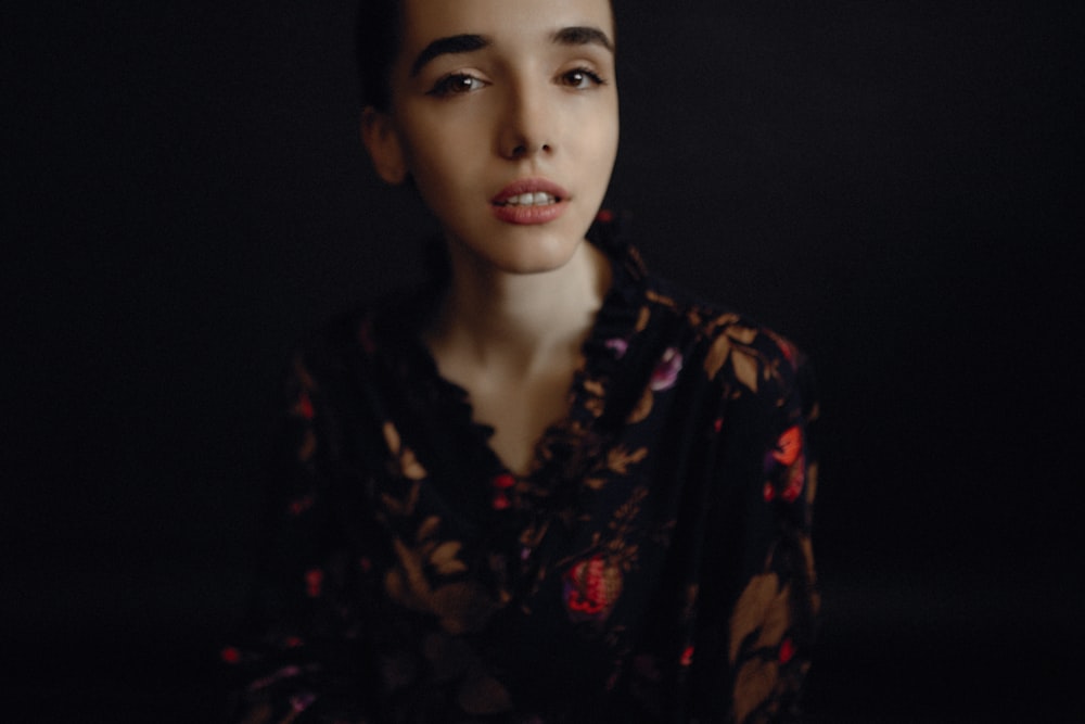 woman wearing black and red floral top