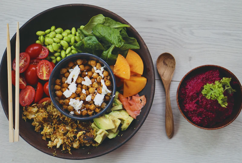 Healthy bowl with chickpeas, salmon and vegetables