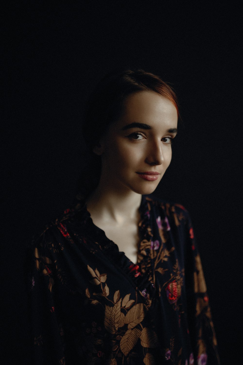 woman wearing black and brown floral top