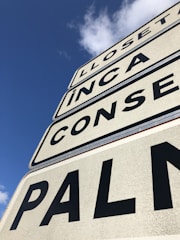 Close-up of road signs being installed.