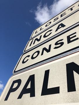 Close-up of road signs being installed.