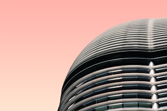 shallow focus photography of building wall under pink skies