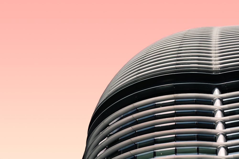 shallow focus photography of building wall under pink skies