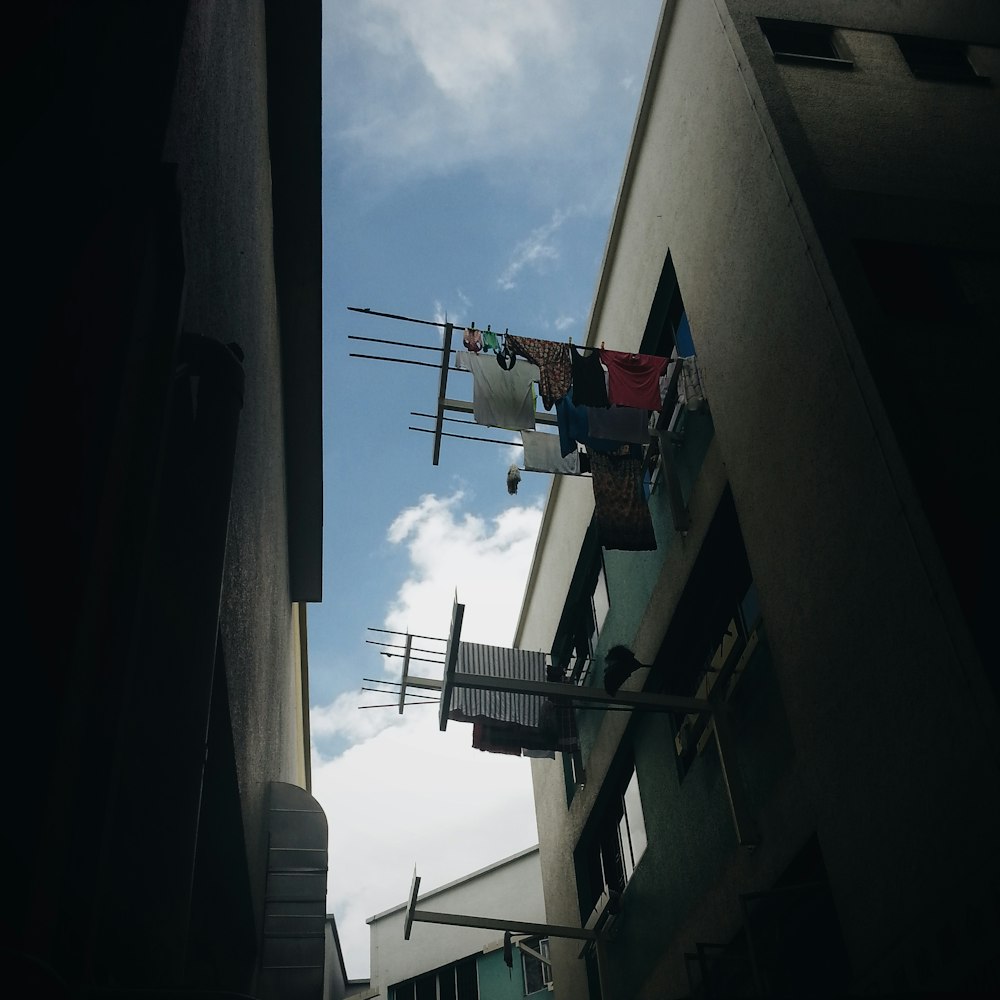 clothes hanging near window during daytime