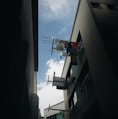 clothes hanging near window during daytime