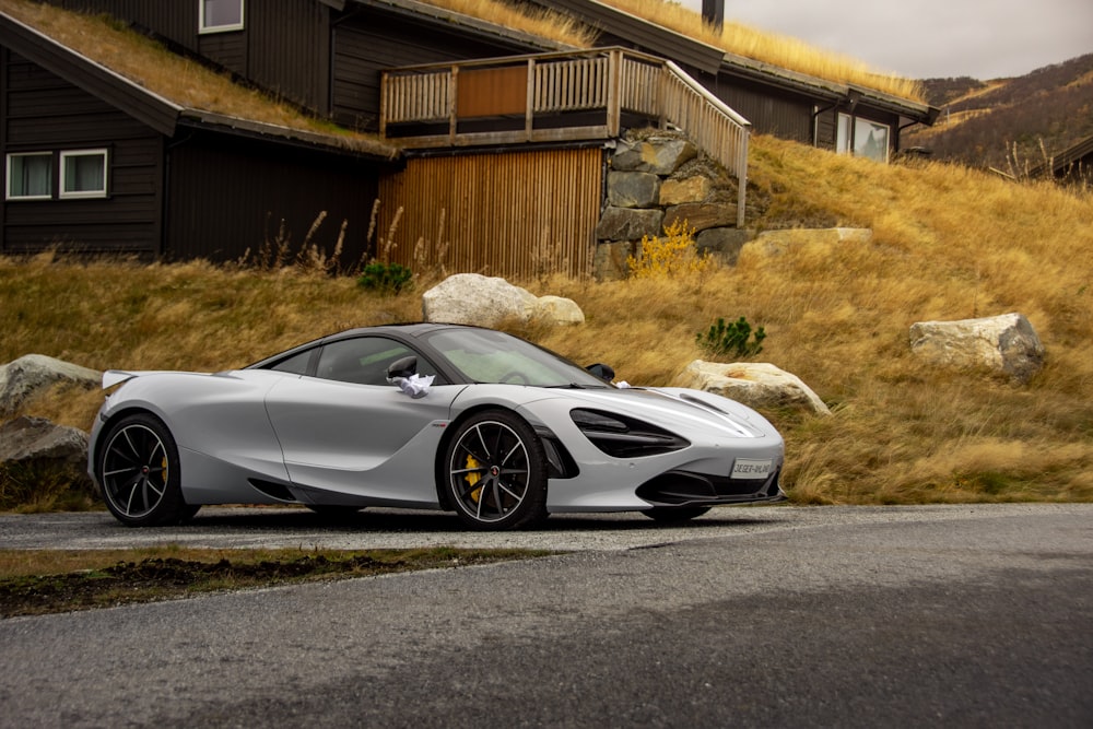 white sports coupe on focus photography