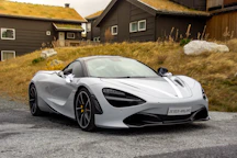 gray sports coupe parking during daytime